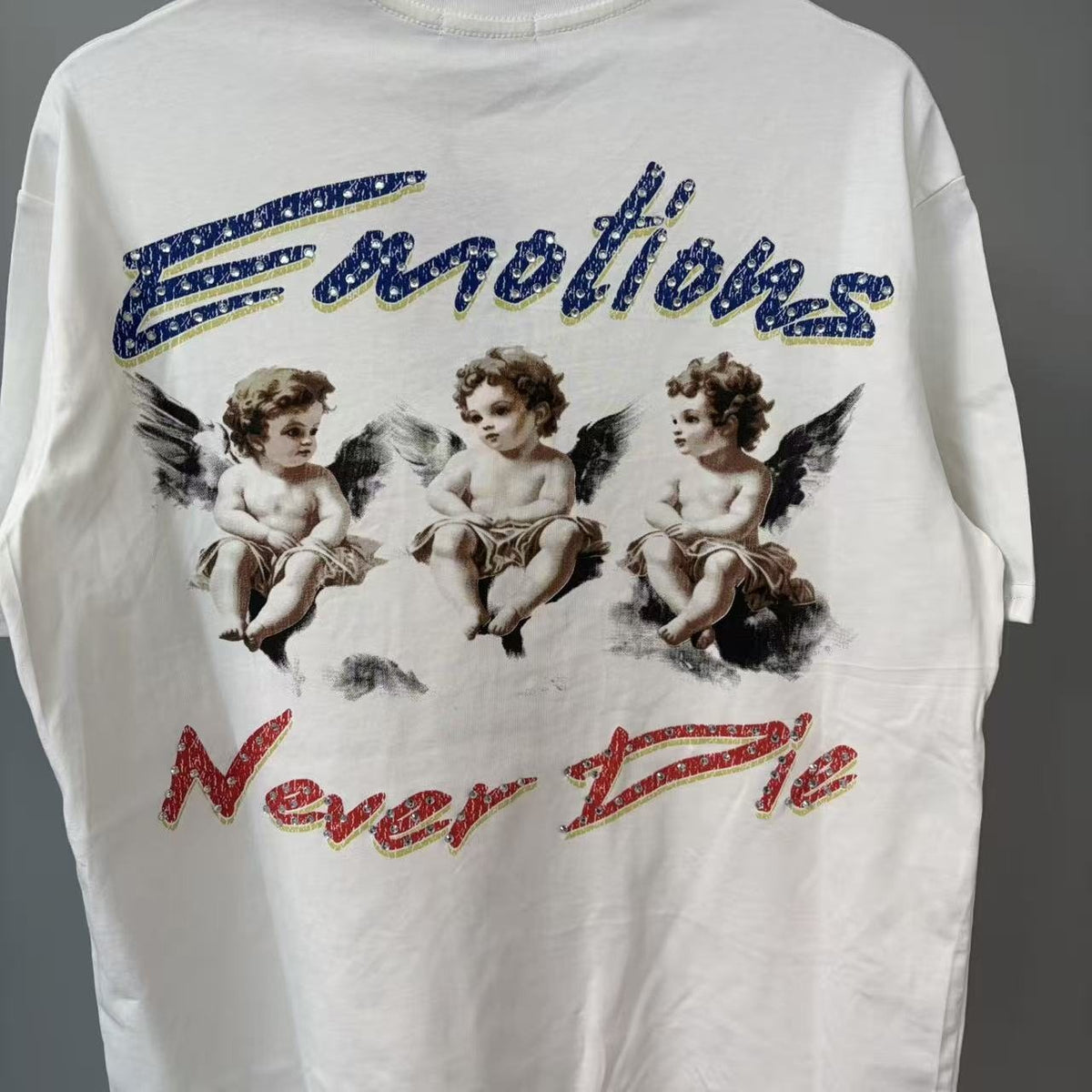 MIXED EMOTION Emotions Never Die Cherub Graphic T-Shirt — front